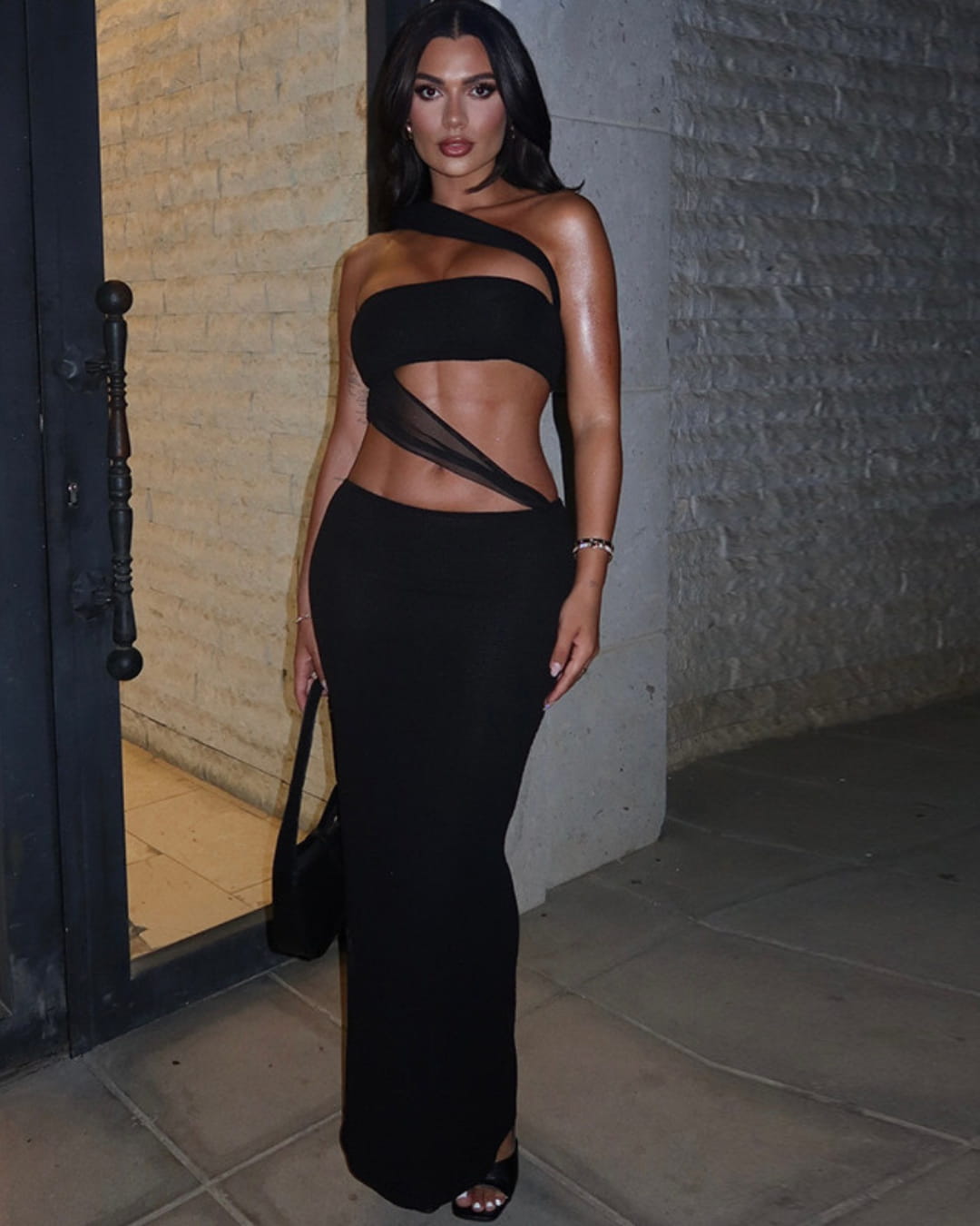 Sexy black one-shoulder maxi dress with mesh cutout design, perfect for evening parties or night out.